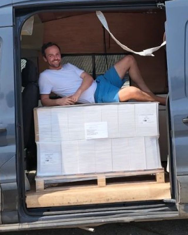 Tom Noble with a pallet of goods in his delivery van